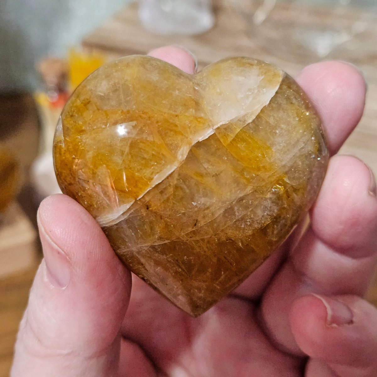 50mm Golden Healer Quartz heart with rich amber and smoky golden natural inclusions.